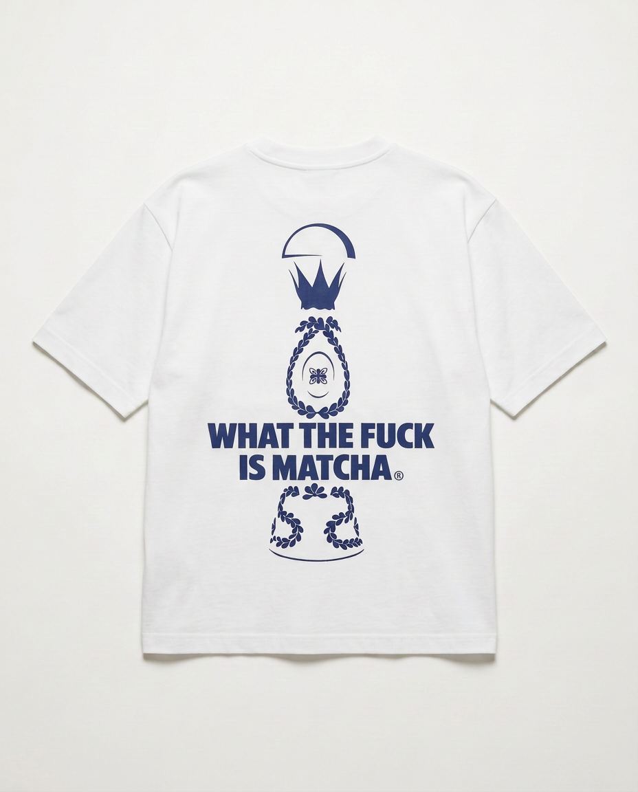 Studio product shot of the back of the oversized white tee with the navy Drop 001 print